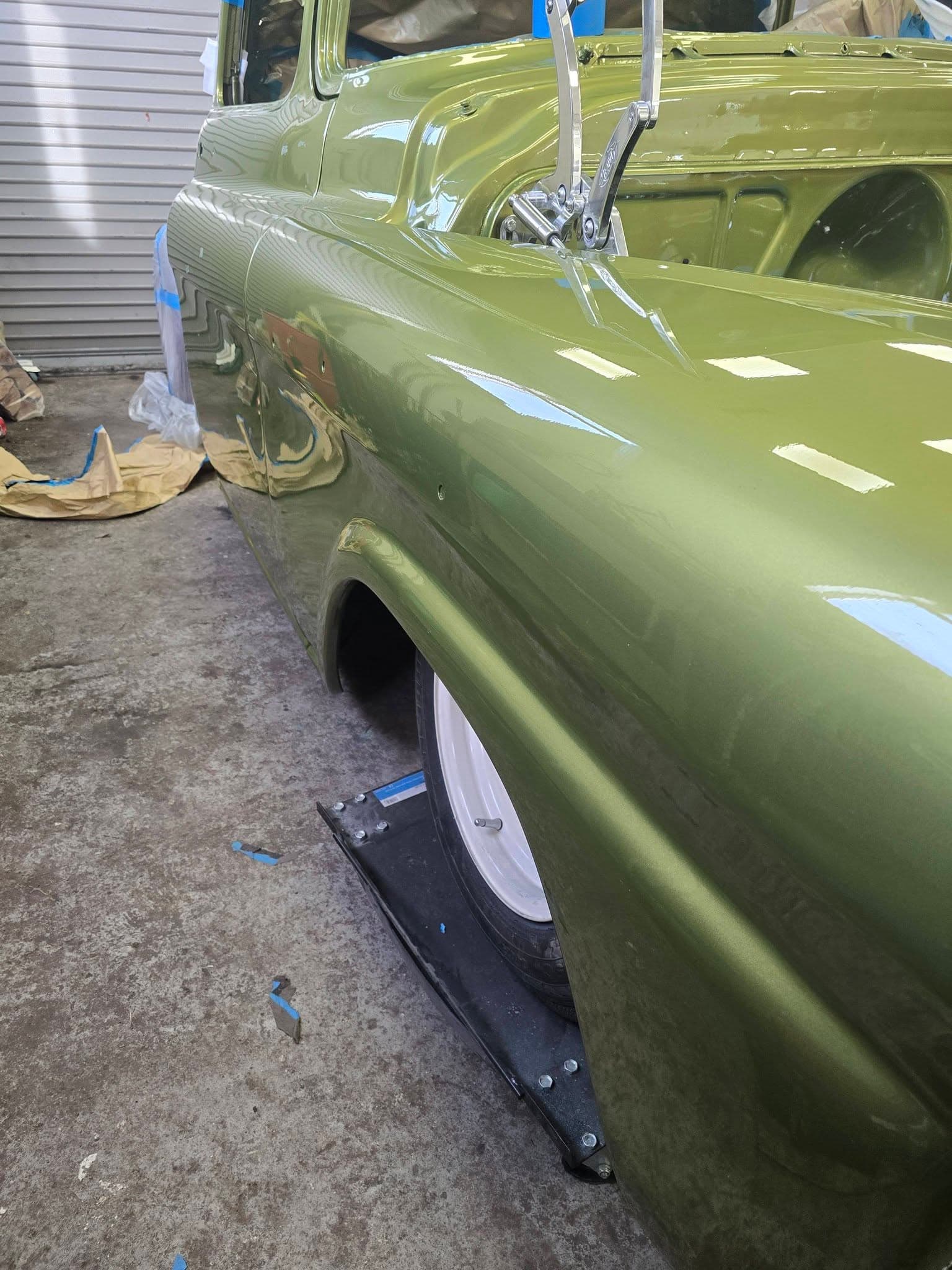 Pickup truck rear quarter showing fresh paint